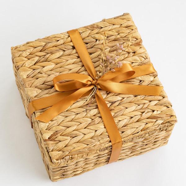 Santa Barbara Company Woven Gift Basket Tied with Ribbon